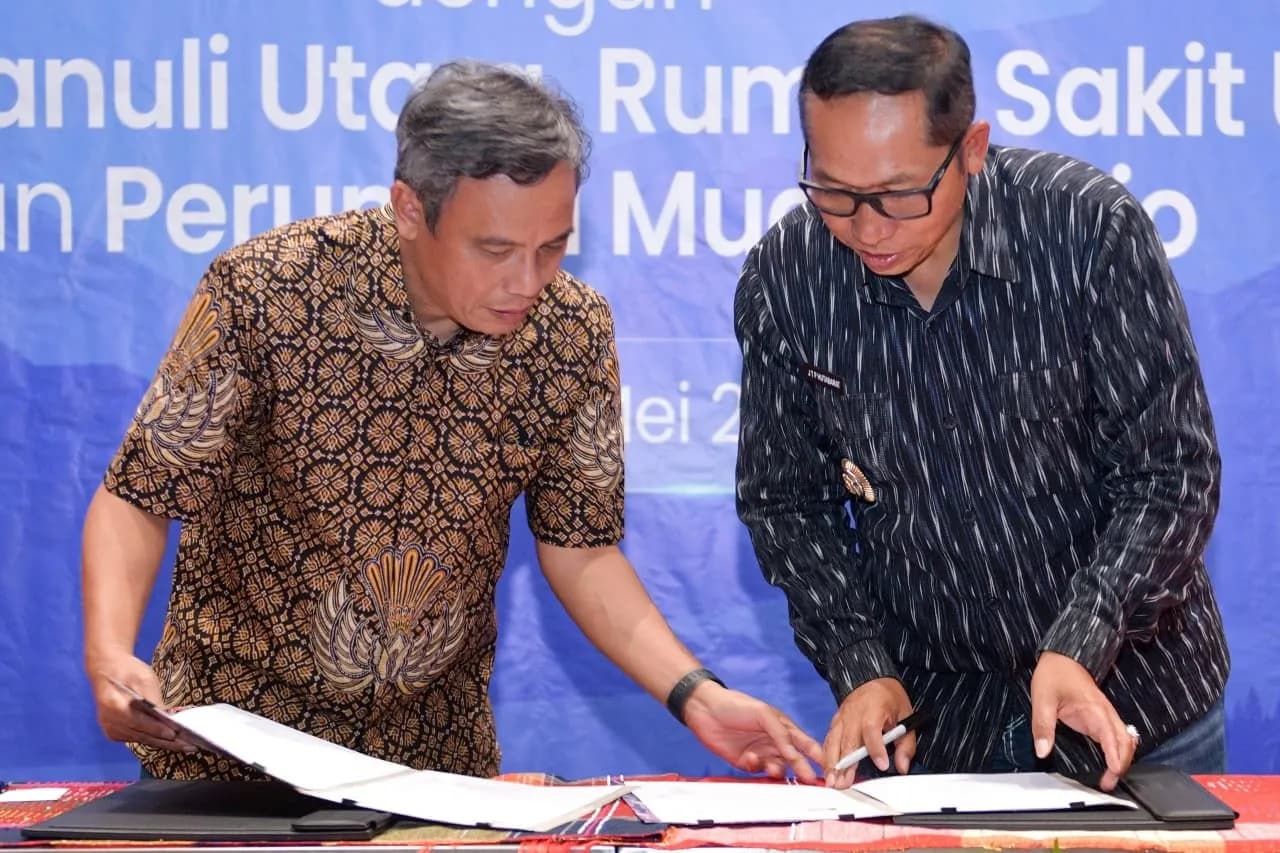 Direktur Utama BTN Nixon L.P. Napitupulu dan Bupati Tapanuli Utara Jonius Taripar Parsaoran Hutabarat