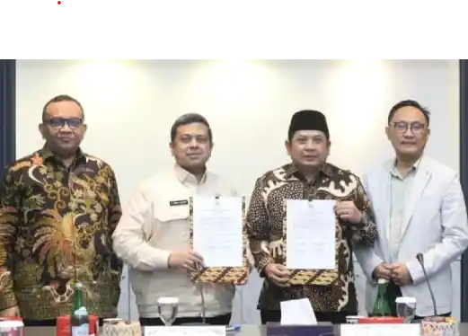 Badan Penyelenggara Jaminan Produk Halal (BPJPH) dan Kementerian Agama, melakukan penandatanganan kesepakatan penetapan, terkait status dan kedudukan satuan kerja badan layanan umum (BLU) di Kementerian Agama. [Foto: Doc. BPJPH]