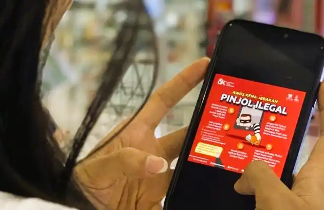Ilustrasi peringatan dari OJK untuk mewaspadai jebakan pinjaman online ilegal (Foto: Antara)
