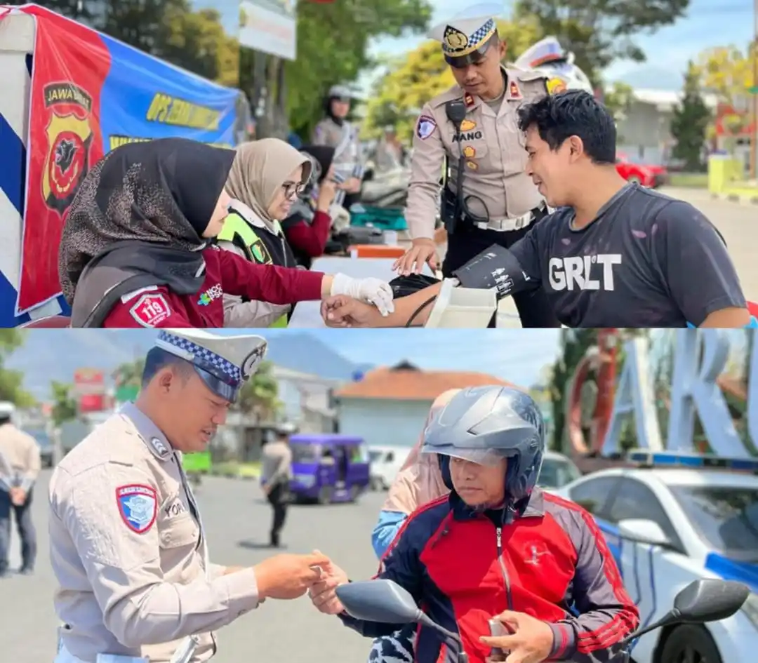 Kasatlantas Polres Garut, Iptu Aang Andi Suhandi saat memimpin kegiatan pengecekan kesehatan dan pemberian vitamin kepada masyarakat di Simpang Lima Kabupaten Garut, Jawa Barat Rabu (16/10/2024). (Foto: Istimewa)